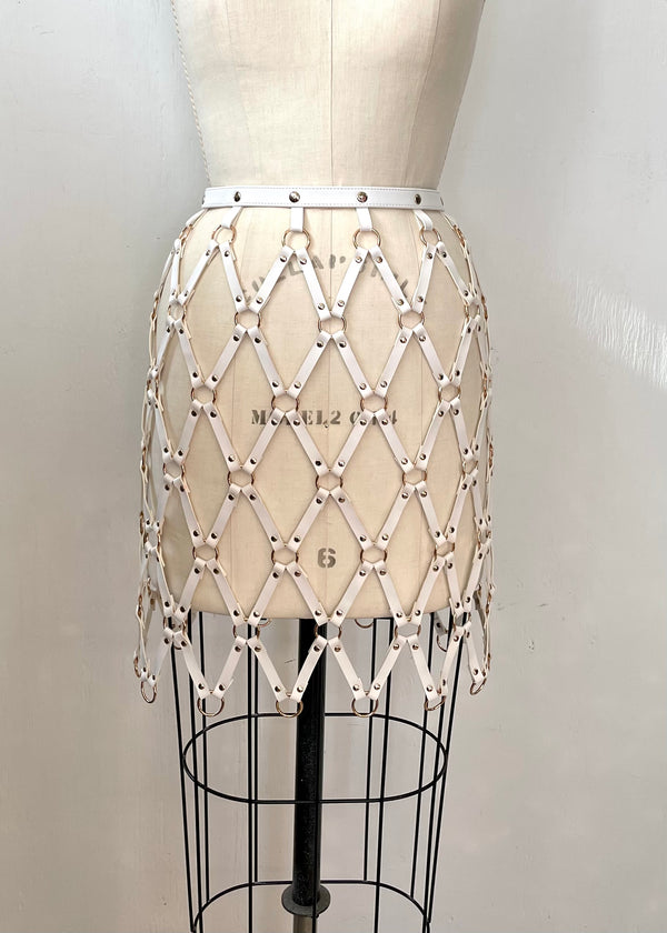 SKIRT white faux leather cage skirt with gold rings & studs, NS