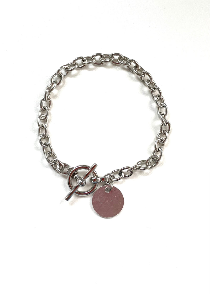 BRACELET silver tone chain bracelet with matte circle charm and toggle closure