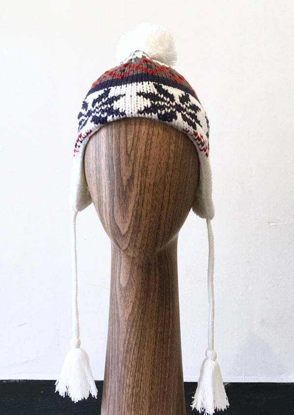 ATTAKID white/grey/red/blue patterned winter hat with pom pom on top, NS