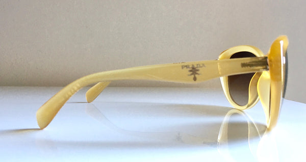 PRADA canary oval oversized sunglasses w/ logo on side temples