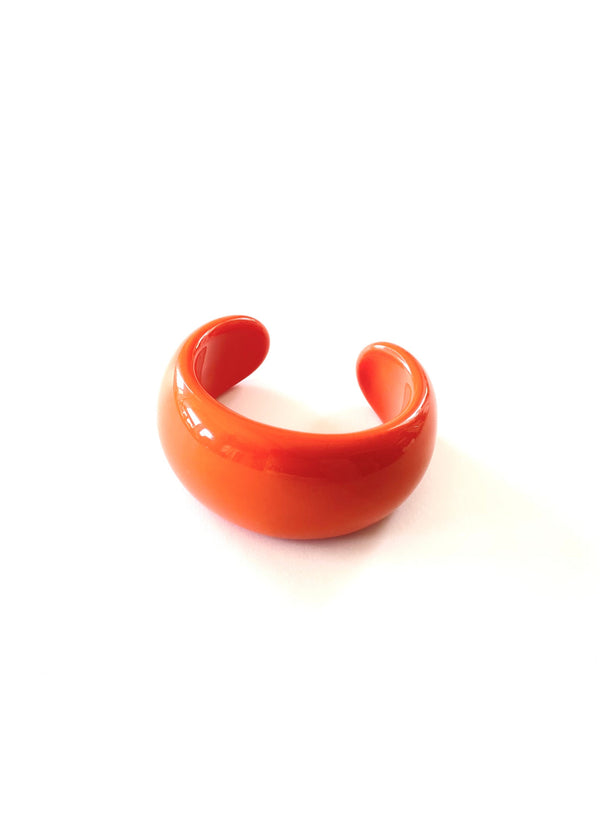 BRACELET orange chunky plastic open bangle, middle 1.5" wide ends taper to  1"