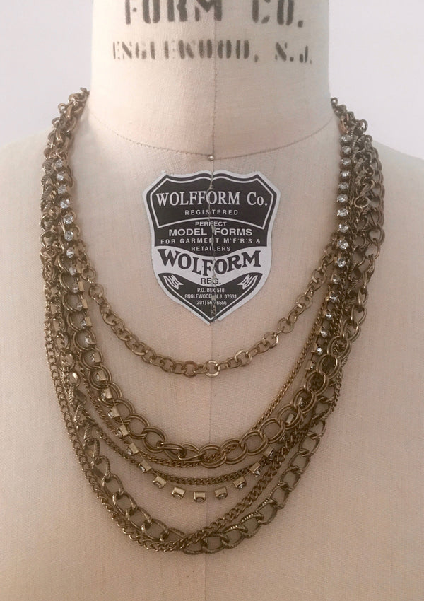 NECKLACE gold tone multi strand chain and rhinestone necklace (some tarnish)