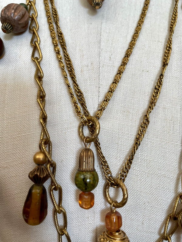 KATE HINES 5 strand gold chain layered necklace w/ brown/orange/green glass beads, 19" long